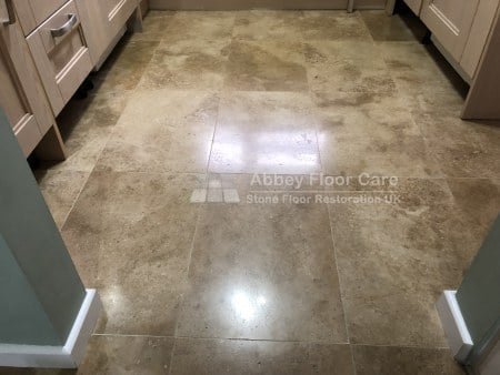 Restored polished travertine floor in Gloucester after repair polishing and sealing